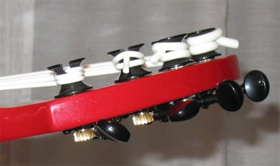 Ashbory with Aquila strings (headstock side view)